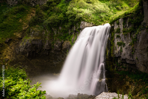 Waterfall in the forest in Kamchatka  Russia. Long exposure shot.