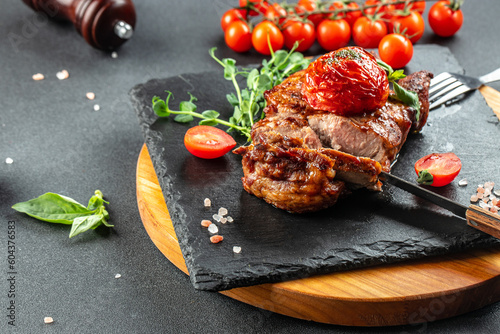 Grilled pork steaks, pork neck with tomatoes, banner, menu, recipe place for text, top view