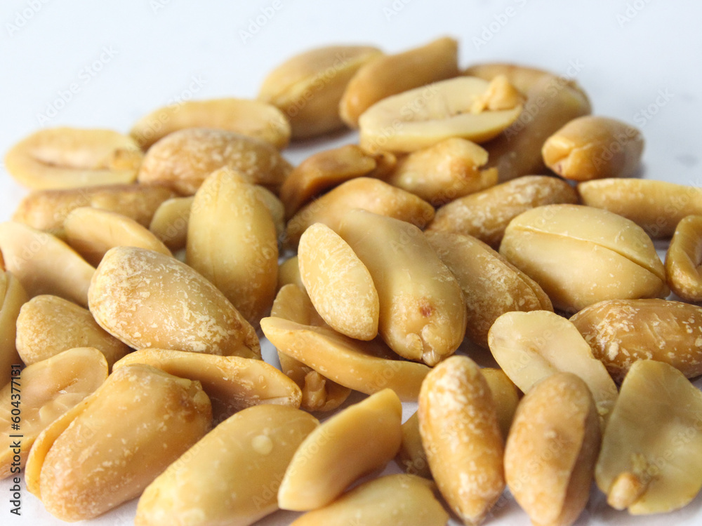 close up of peanuts isolated on white close up of peanuts isolated on white