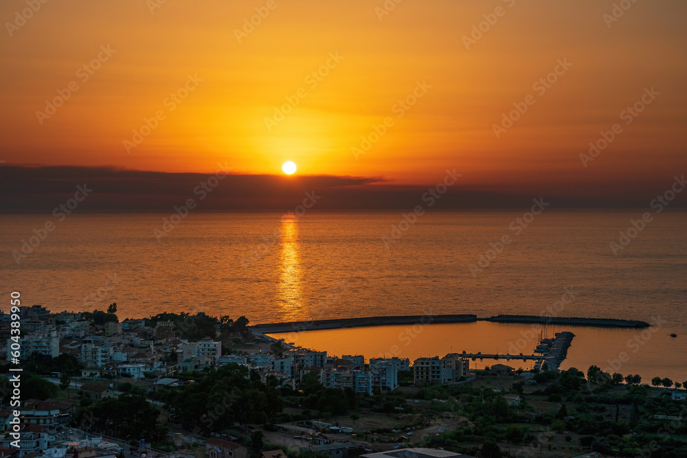 Beautiful sunset view by the historical castle of Kyparissia coastal town at sunset. Located in northwestern Messenia, Peloponnese, Greece, Europe.