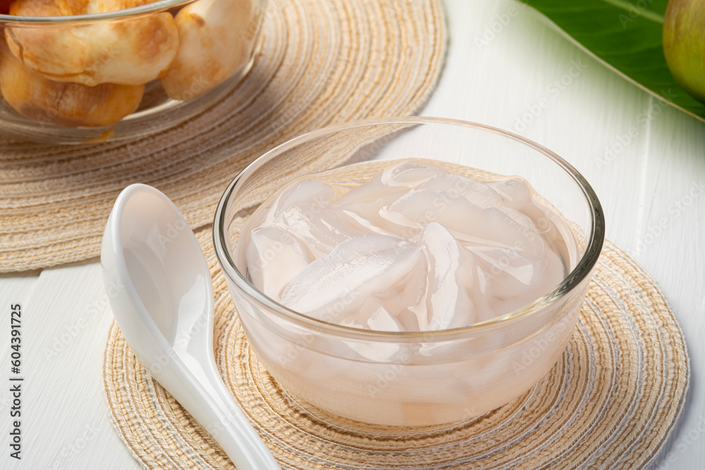 Toddy Palm in Syrup,Sliced sweet fresh Palmyra palm with syrup in glass bowl,Thai dessert for hot summer (Luk Tarn Loi Kaew) Toddy Palm in Syrup,Sliced sweet fresh Palmyra palm with syrup in glass bowl,Thai dessert for hot summer (Luk Tarn Loi Kaew)