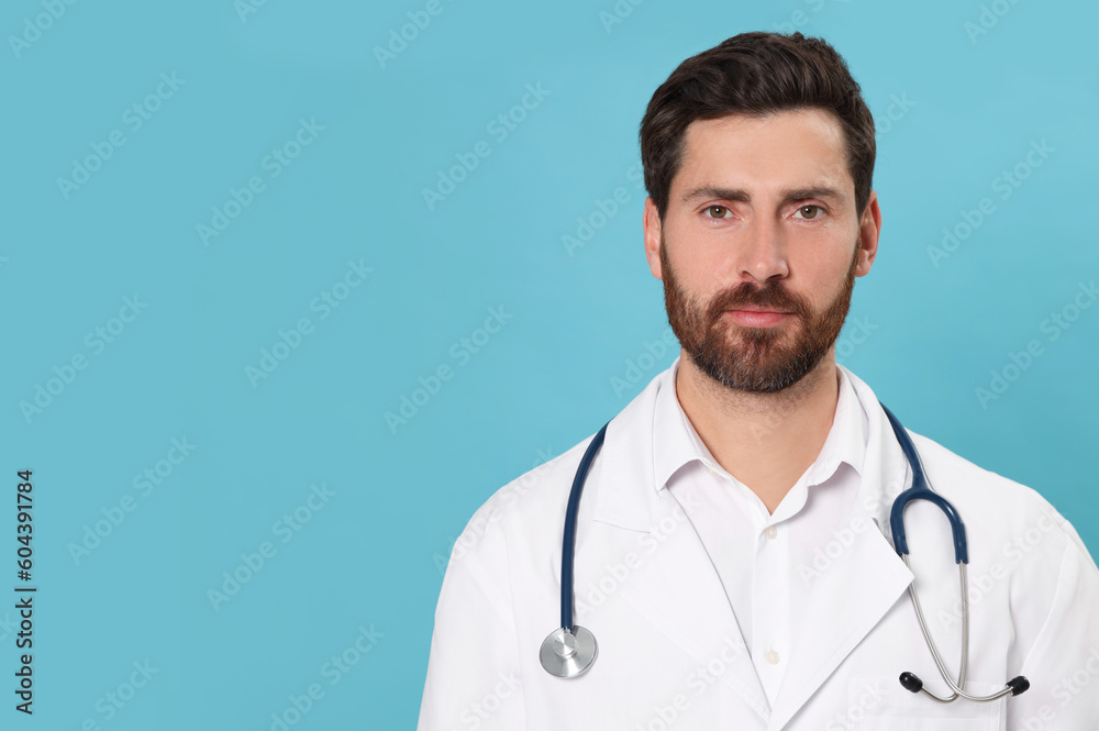 Nurse in medical uniform with stethoscope on light blue background, space for text Nurse in medical uniform with stethoscope on light blue background, space for text