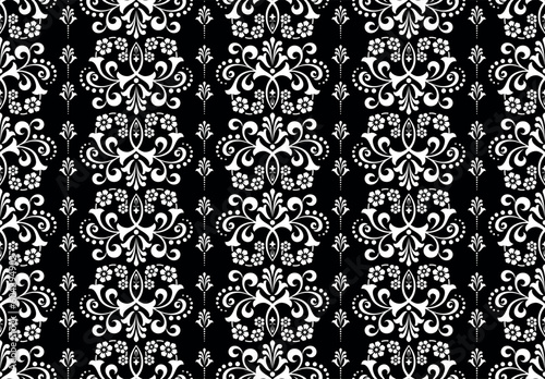 Wallpaper in the style of Baroque. Seamless vector background. White and black floral ornament. Graphic pattern for fabric, wallpaper, packaging. Ornate Damask flower ornament