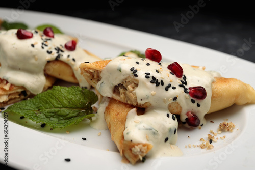 savoury chicken crepes with sour cream and sesame seeds