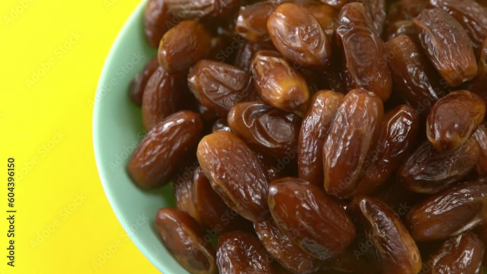Dates. Dried date palm fruits. Healthy sweet snack food bowl. Pile of tasty dry dattes in plate. Date harvest symbolizing Ramadan. Dates. Dried date palm fruits. Healthy sweet snack food bowl. Pile of tasty dry dattes in plate. Date harvest symbolizing Ramadan.