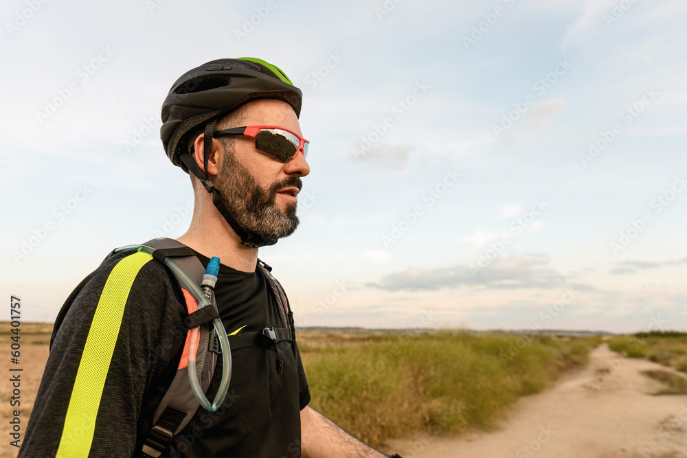 Portrait of a bicyclist with sunglasses and helmet