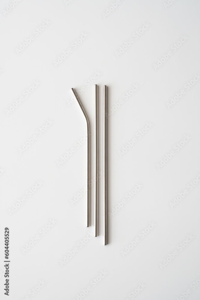 Top view of three style of reuse straw made from aluminum, isolated on white, vertical frame Top view of three style of reuse straw made from aluminum, isolated on white, vertical frame