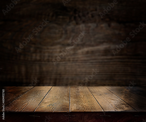  An empty wooden countertop against a black, dark concrete wall. Home interior. Evening, dim light. Space for text. Copy space 