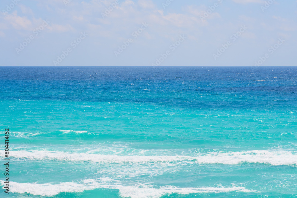 Waves of the caribbean sea with horizon on the background.