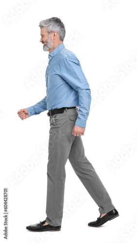 Mature businessman in stylish clothes posing on white background