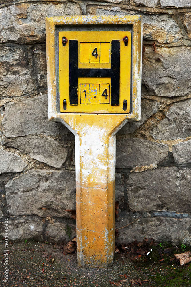 Old Fire Water hydrant yellow sign. It's a marker plate which indicates