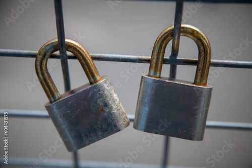 two padlocks on a fence love symbol romance concept couple forever long term relationship