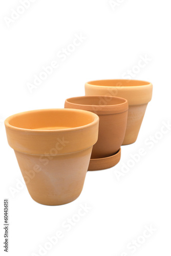 Empty clay flower pots of different shapes isolated on a white background