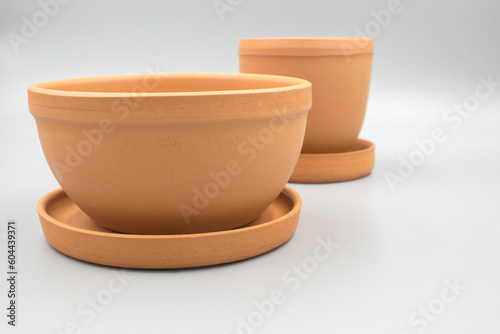 Empty clay flower pots isolated on a white background