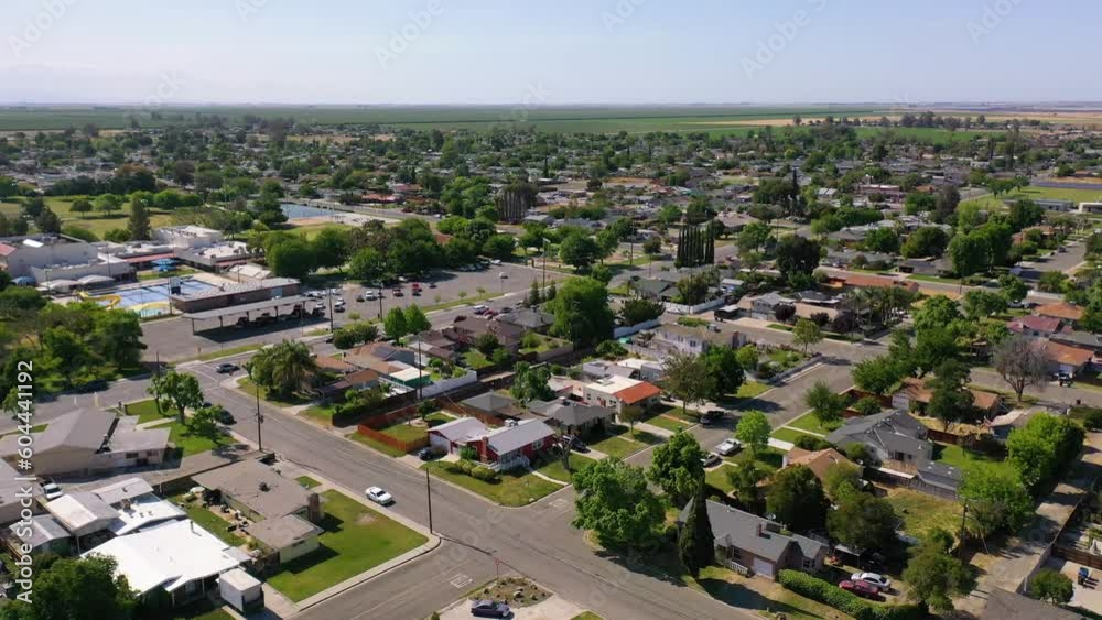 2023 - Excellent aerial view moving across several residential blocks in Corcoran, California with traffic on the roads. 2023 - Excellent aerial view moving across several residential blocks in Corcoran, California with traffic on the roads.