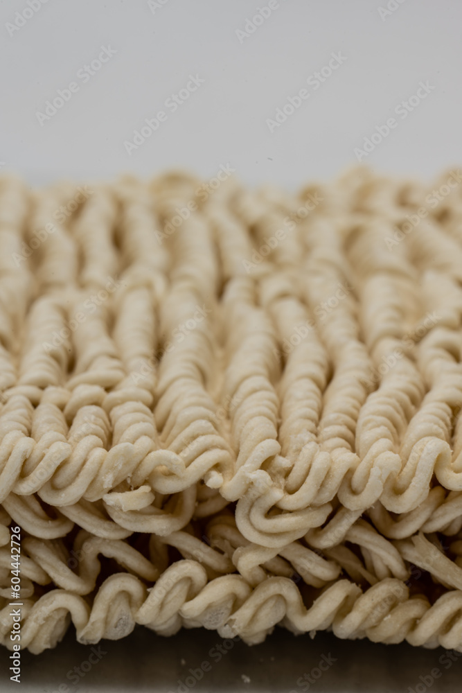 Dry instant ramen noodles on white background. Dry instant ramen noodles on white background.