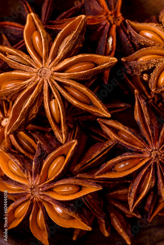 Star shaped spice star anise in a wooden round bowl