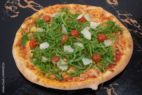 Photography beautiful closeup pizza image and mozzarella, fresh tomatoes, arugula, grana