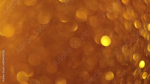 gold sparkling background bokeh. Elegant gold background with glitter sparkle bokeh