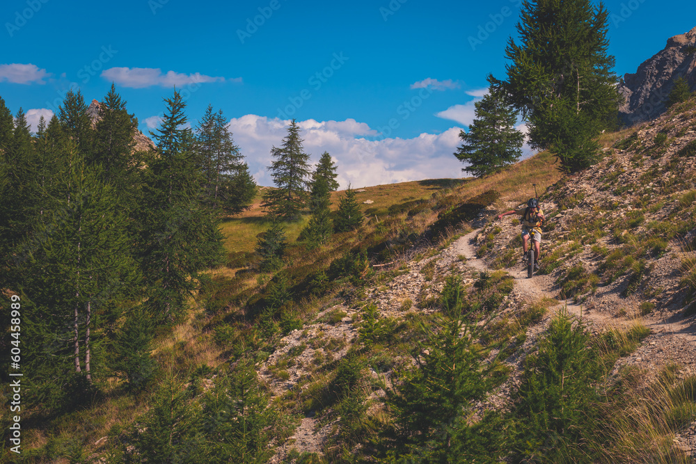 A unicyclist in the French Alps, on the way to Col du Cros