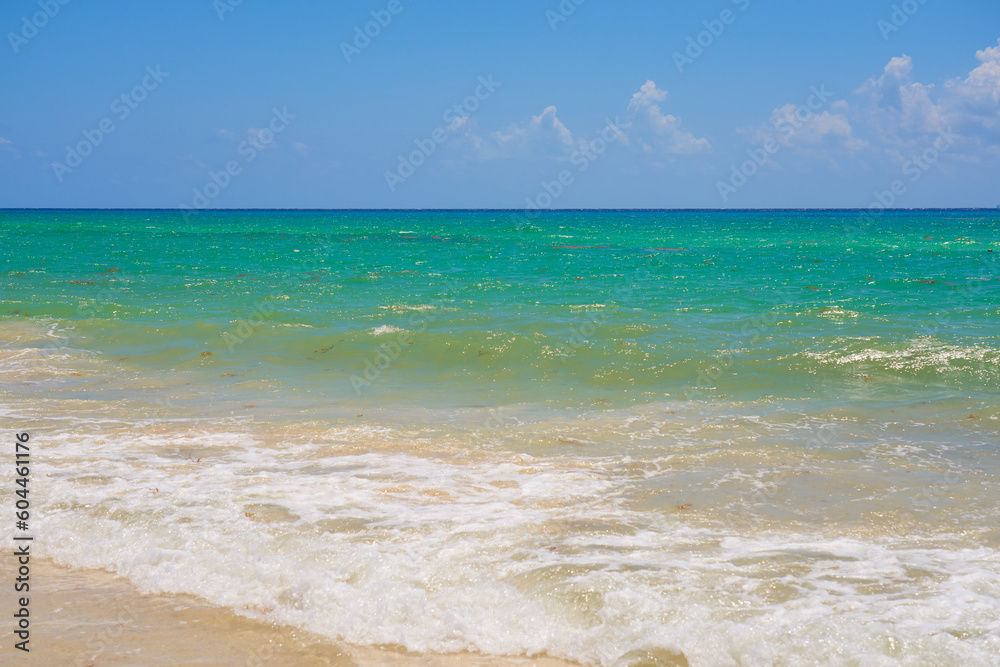 Waves with foam on the Caribbean coast in Mexico. Waves with foam on the Caribbean coast in Mexico.