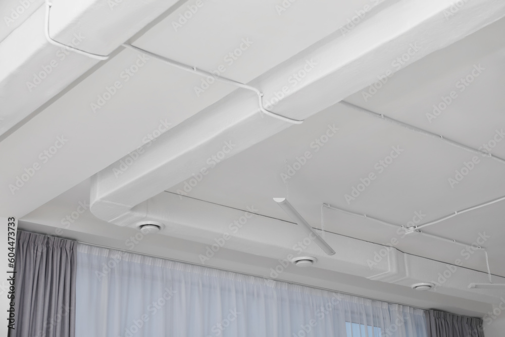 White ceiling with modern lighting in office White ceiling with modern lighting in office