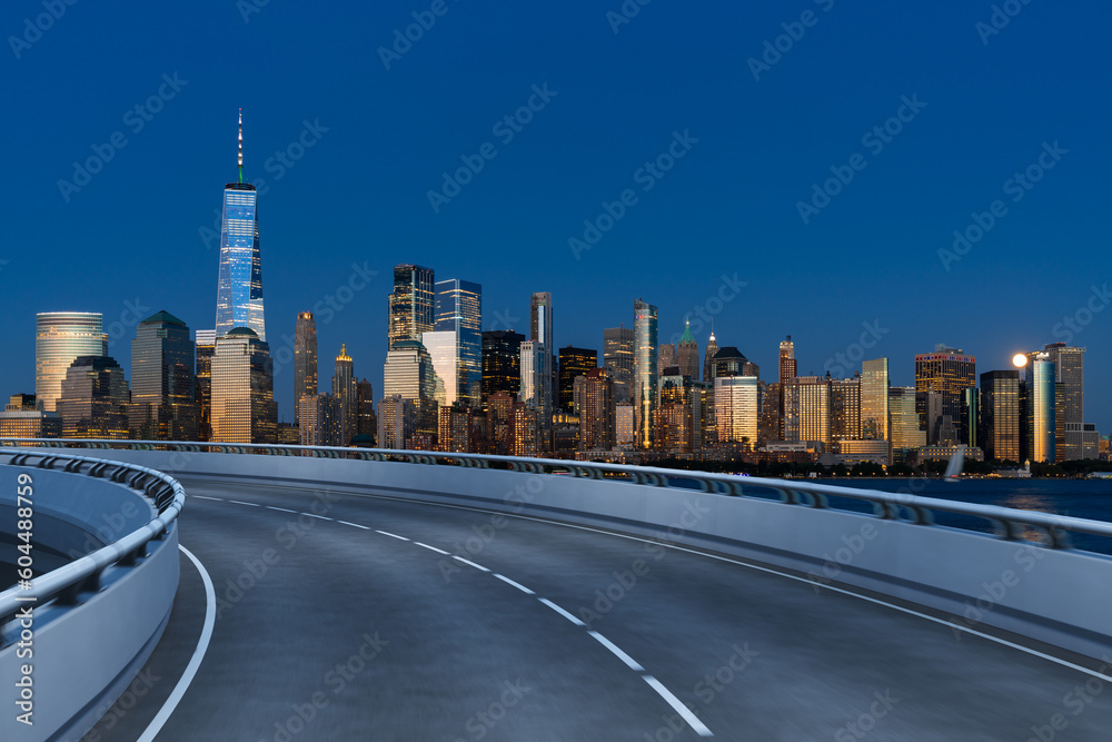 Obraz premium Empty urban asphalt road exterior with city buildings background. New modern highway concrete construction. Concept of way to success. Transportation logistic industry fast delivery. New York. USA.