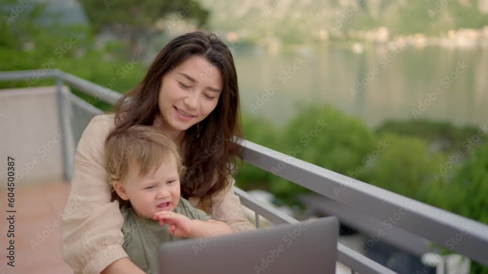 Mother multi-tasking, holding baby infant and using computer laptop home. Candid authentic and real life mom working and parenting. multitasking mom working remote stressed out. Problems associated Mother multi-tasking, holding baby infant and using computer laptop home. Candid authentic and real life mom working and parenting. multitasking mom working remote stressed out. Problems associated