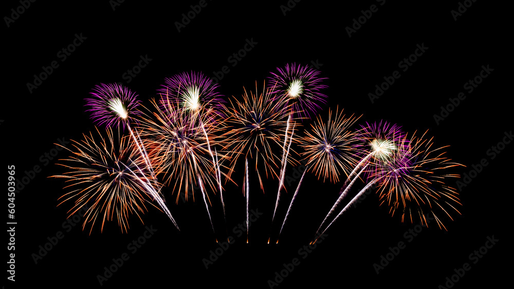 Festive new year orange and pink fireworks on black background