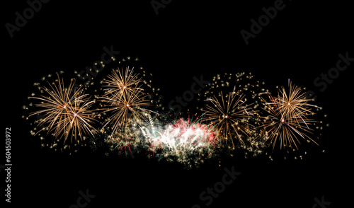 Festive new year golden fireworks on black background