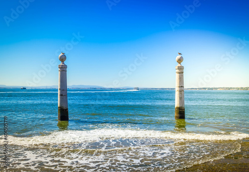 two posts at the embankment of Lisbon
