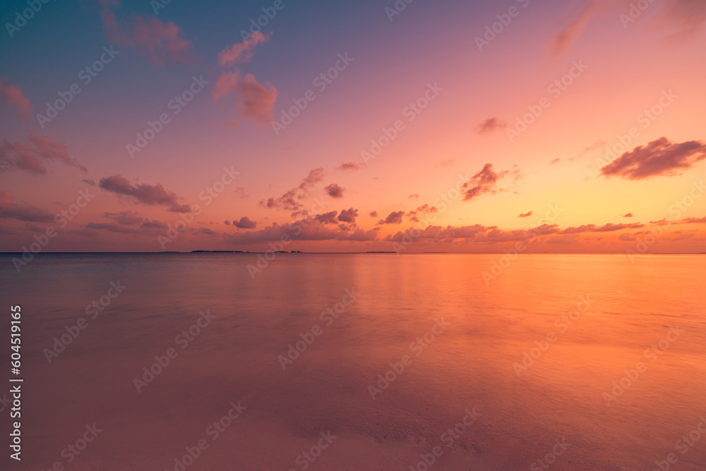 Sea sand sky closeup, sunset colors clouds horizon peaceful seascape panoramic banner. Inspirational beautiful nature, exotic travel landscape of tropical beach. Beach shore sunrise summer tranquility