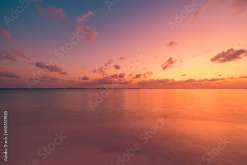Sea sand sky closeup, sunset colors clouds horizon peaceful seascape panoramic banner. Inspirational beautiful nature, exotic travel landscape of tropical beach. Beach shore sunrise summer tranquility © icemanphotos