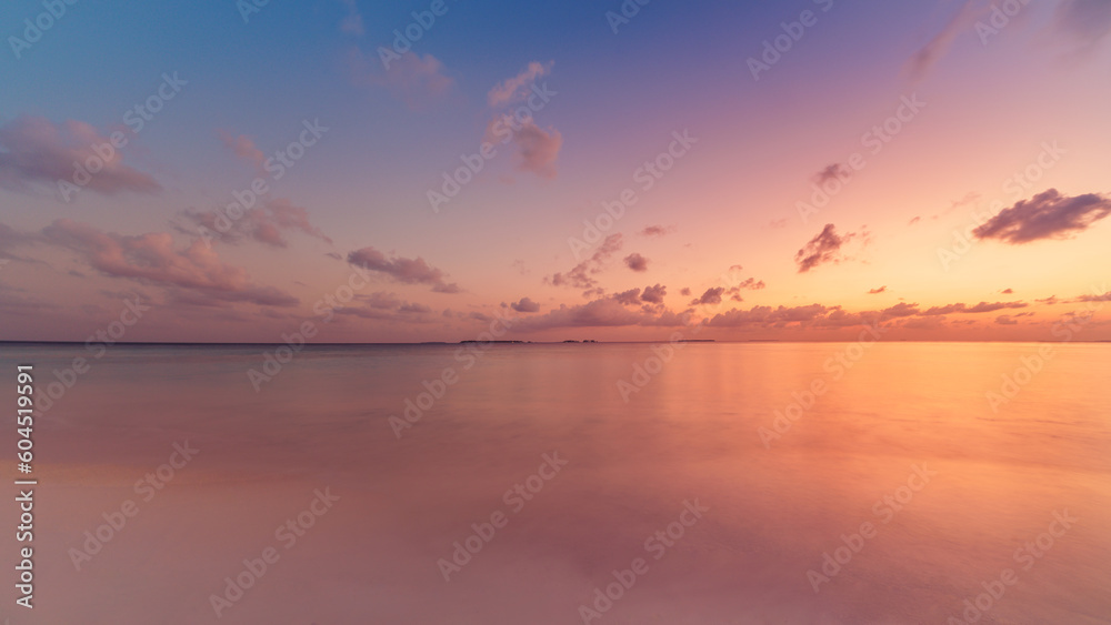 Fototapeta premium Sea sand sky closeup, sunset colors clouds horizon peaceful seascape panoramic banner. Inspirational beautiful nature, exotic travel landscape of tropical beach. Beach shore sunrise summer tranquility