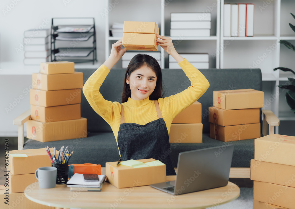 tarting Small business entrepreneur SME freelance,Portrait young woman working at home office, BOX,smartphone,laptop, online, marketing, packaging, delivery, SME, e-commerce concept tarting Small business entrepreneur SME freelance,Portrait young woman working at home office, BOX,smartphone,laptop, online, marketing, packaging, delivery, SME, e-commerce concept