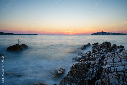 Sunset at the sea in Primo  ten  Croatia  with rocks in the foreground