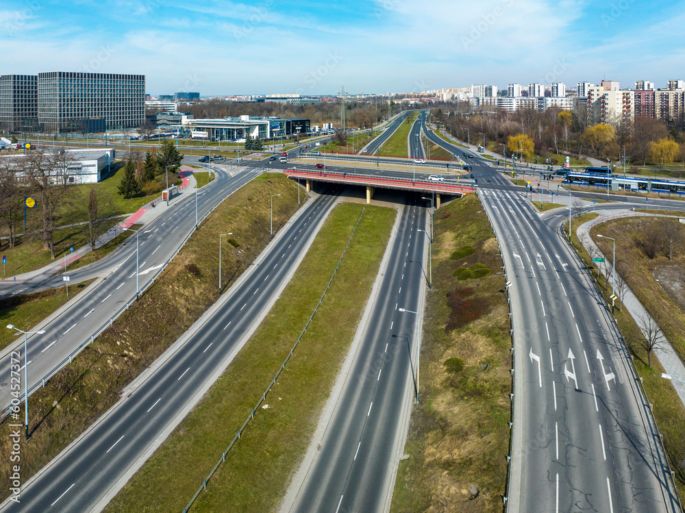 City highway multilevel junction in Krakow, Poland. Tramway and tram, bus, cars, cycle tracks and public parks. Aerial view City highway multilevel junction in Krakow, Poland. Tramway and tram, bus, cars, cycle tracks and public parks. Aerial view