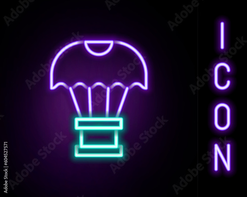 Glowing neon line Box flying on parachute icon isolated on black background. Parcel with parachute for shipping. Delivery service  air shipping. Colorful outline concept. Vector
