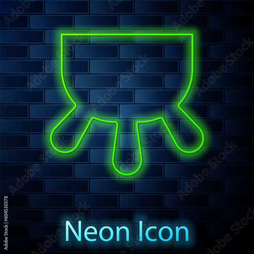 Glowing neon line Udder icon isolated on brick wall background. Vector