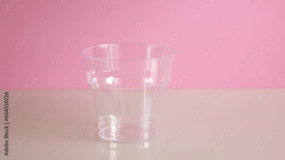 Beetroot latte or pink moon milk poured into disposable plastic cup. Trendy caffeine free and