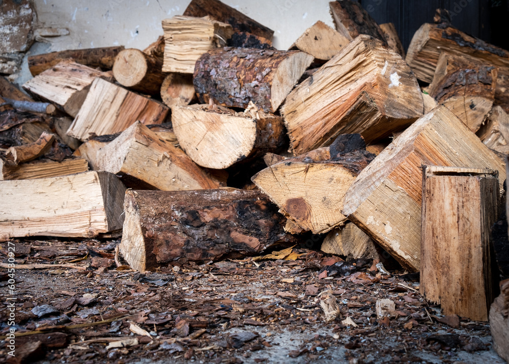 Pile of pine heap firewoods in a stack. Nutural wood for winter fuel at home Pile of pine heap firewoods in a stack. Nutural wood for winter fuel at home