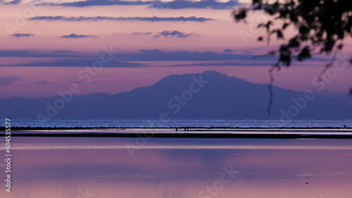 Beautiful purple sunset sky and ocean with tropical island of Atauro in Timor-Leste, Southeast Asia