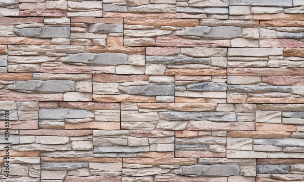 Artificial stone wall with uneven stones. Modern architecture concept idea Artificial stone wall with uneven stones. Modern architecture concept idea