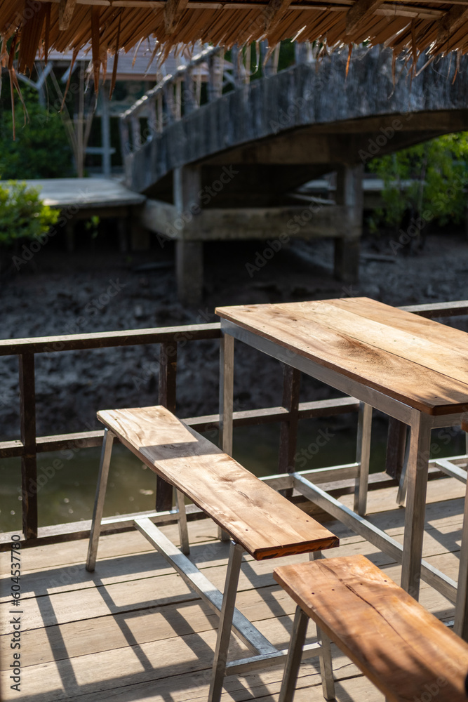 Chairs and wooden tables by the canal, the local lifestyle.