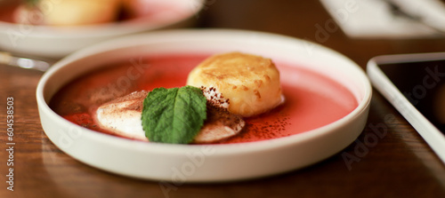 Banner Cheesecakes with yogurt and mint. Cottage cheese casserole. Dessert in a restaurant