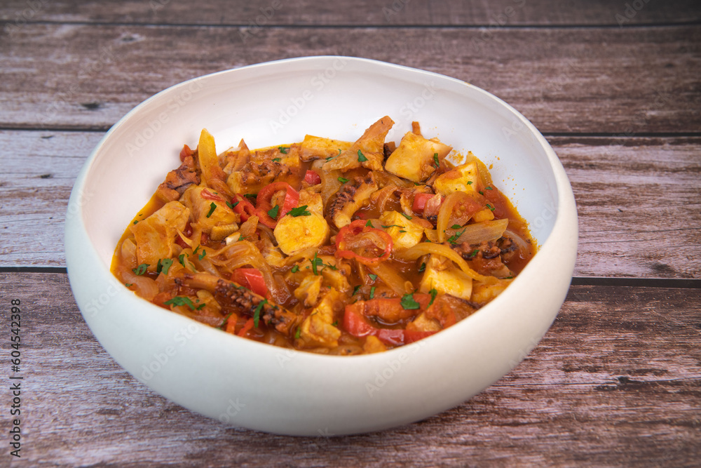 Recipe for octopus Provencal style, tomato, onion, garlic, red pepper, parsley, High quality photo Recipe for octopus Provencal style, tomato, onion, garlic, red pepper, parsley, High quality photo