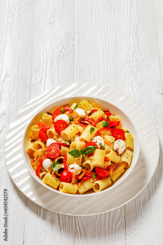 pepper tomato mozzarella pasta salad in bowl