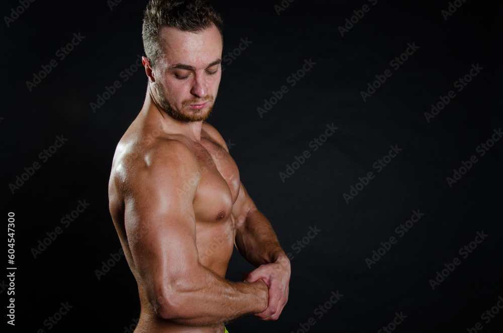 Fototapeta premium Poor health. Men's problems. Attractive man posing in the studio.