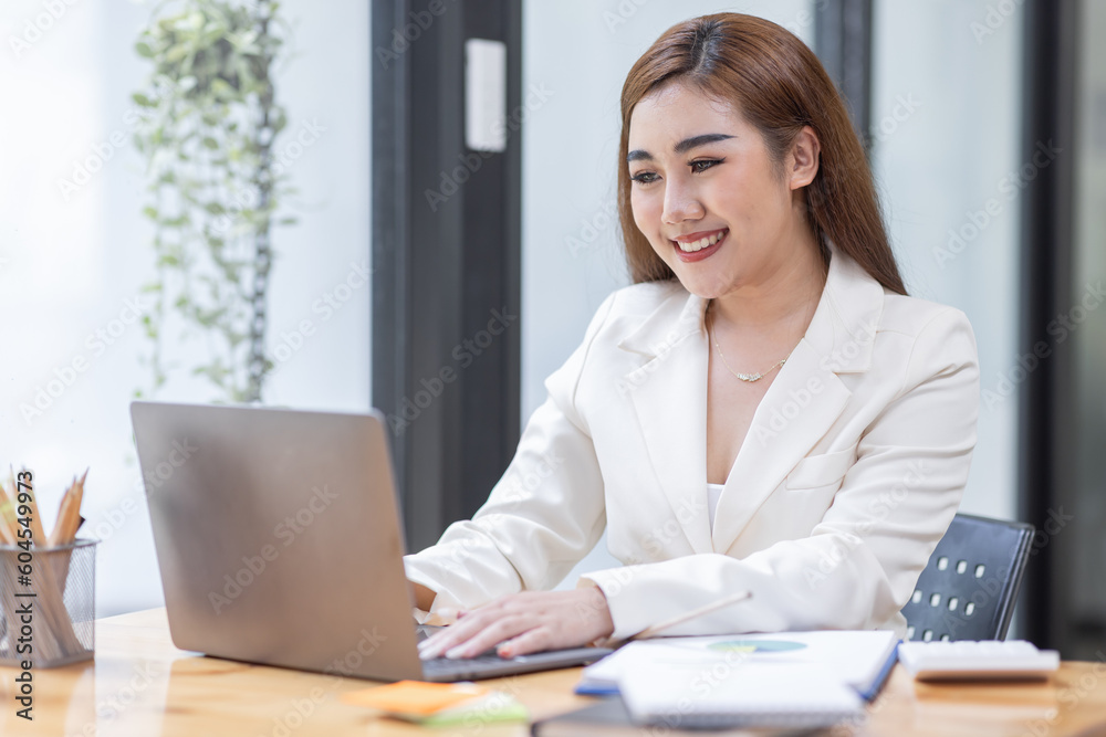Business Asian woman working at office with documents on his desk, doing planning analyzing the financial report, business plan investment, finance analysis concept	