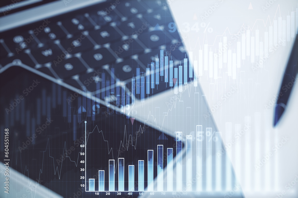 Multi exposure of abstract financial graph on laptop background, financial and trading concept